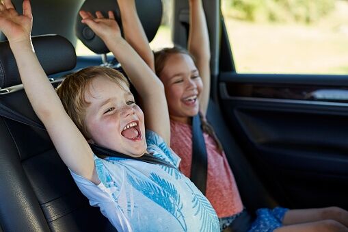 Brother and sister in car