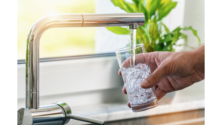 Cropped Hands Holding Drinking Glass Under Tap