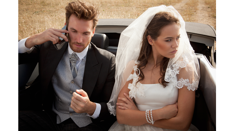 Newlywed couple arguing in car