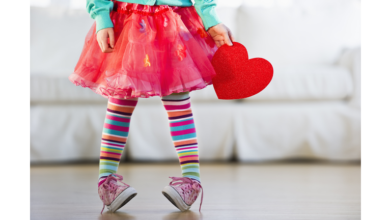 Young girl wearing colorful tights