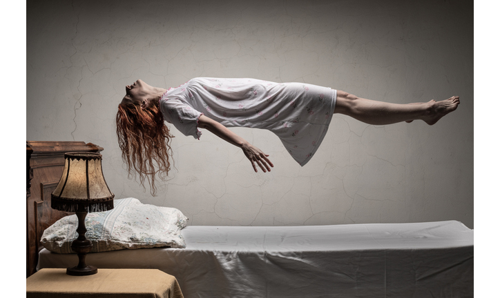 Woman levitating over bed / astral traveling, nightmare, excorcist halloween concept