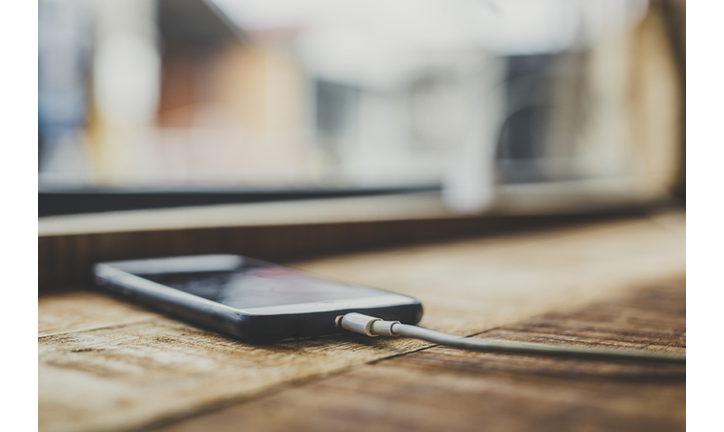 smartphone charging on table.