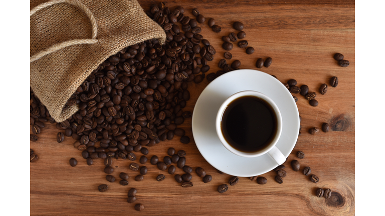 Close-Up Of Coffee Up With Beans On Table