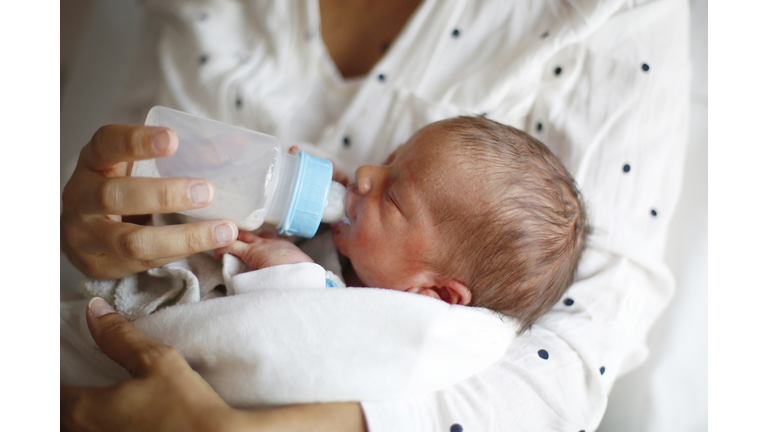 A newborn drinking milk at maternity ward