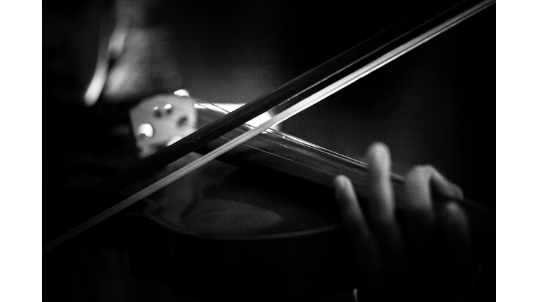 Close-Up Of Person Playing Violin