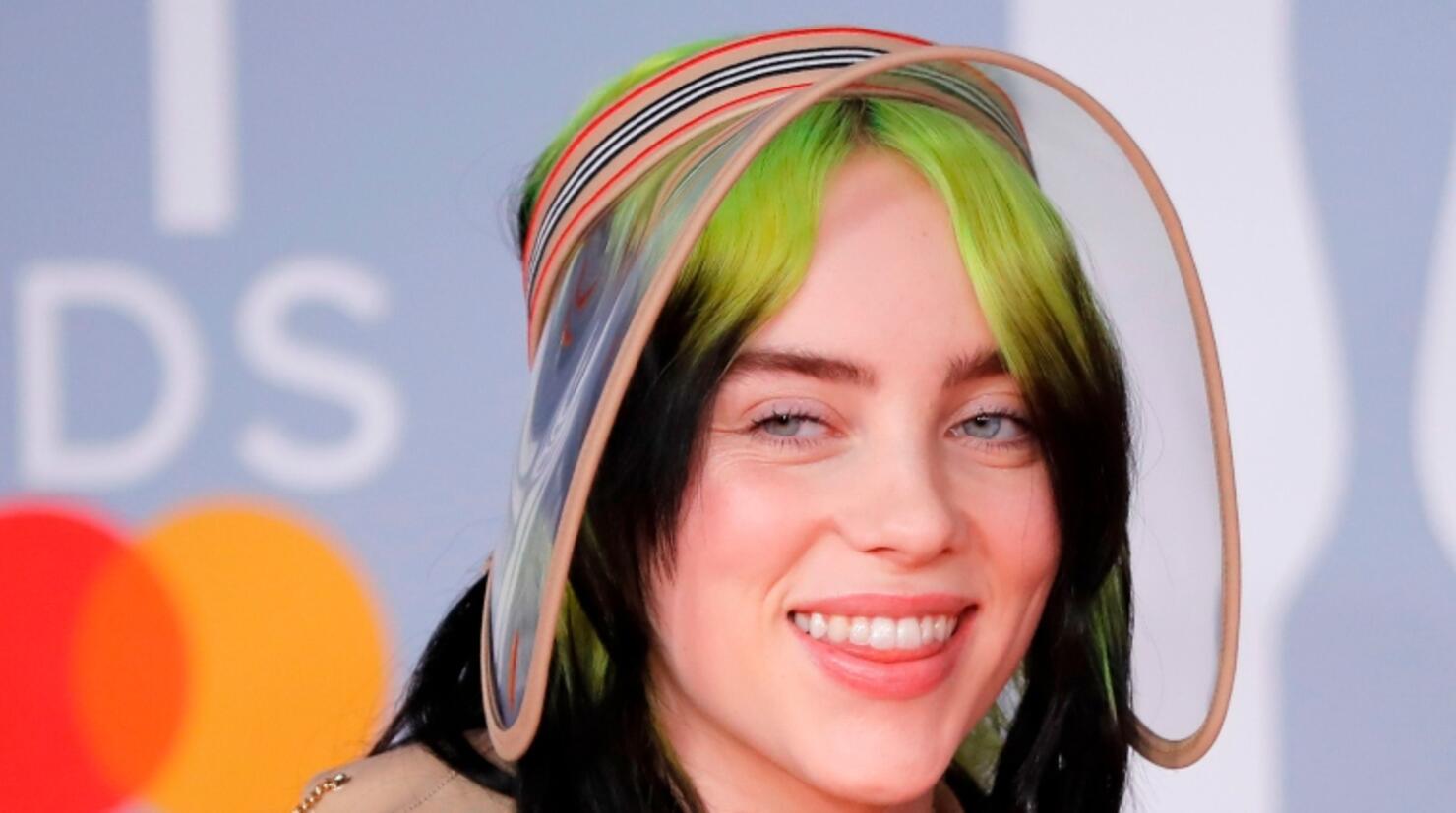 You Can Now Own Billie Eilish's Yellow Rainsuit From The 'Bellyache' Video  | iHeart