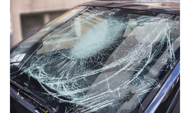 Gunshot damage on car window