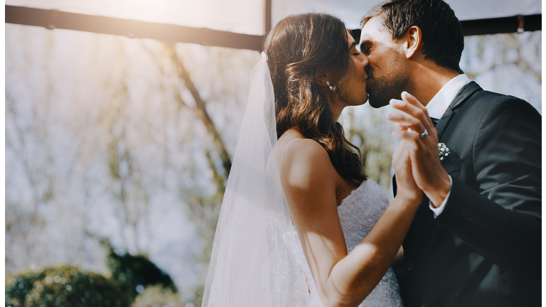 The bride is his to kiss