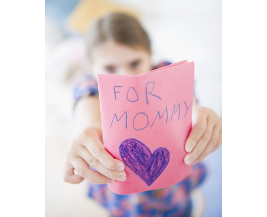 USA, New Jersey, Jersey City, Girl ( 6-7) showing greeting card for mother's day