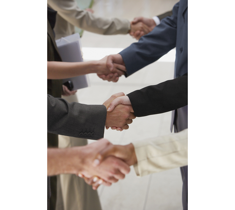 Close-up of business people shaking hands