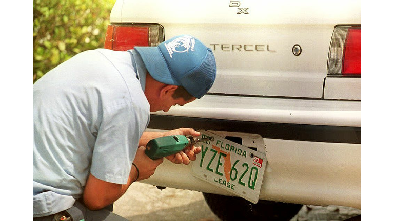 Juan Alberto, a mechanic at Alamo Car rental, remo