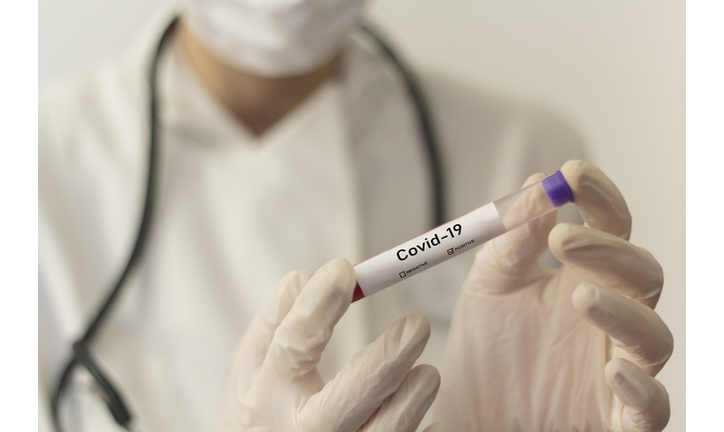 Doctor Holding Coronavirus Test Tube In Laboratory