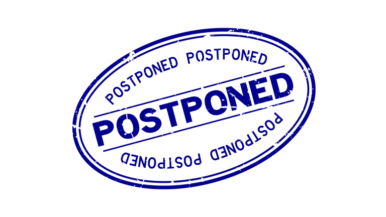 Grunge blue postponed word oval rubber seal stamp on white background