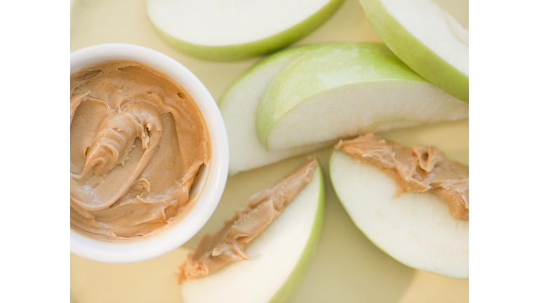 Peanut butter on sliced apple