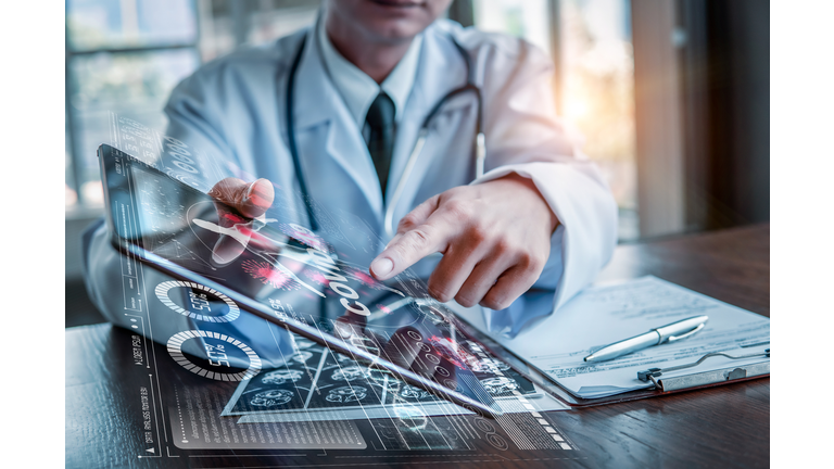 Doctor holding tablet with futuristic hud screen tablet. Covid-19, Bacteria, virus, microbe. Medical concept of the future.