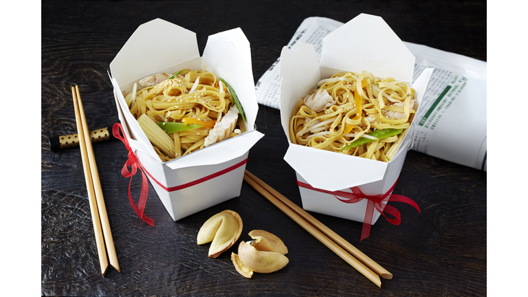 Still life with chinese noodles in takeaway boxes, asian takeaway food