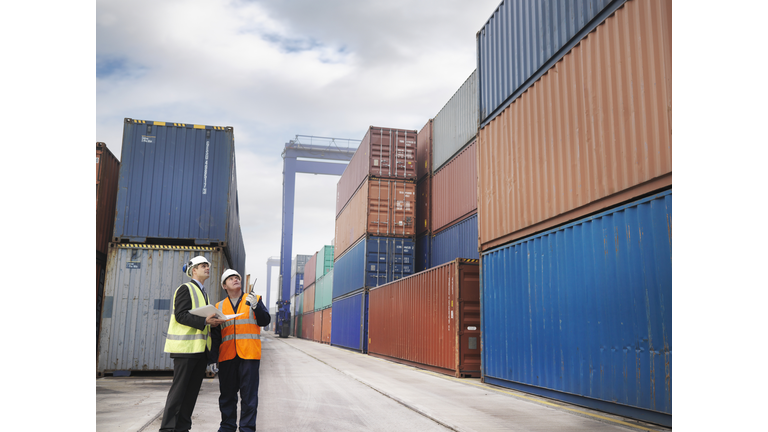 Port Workers With Shipping Containers