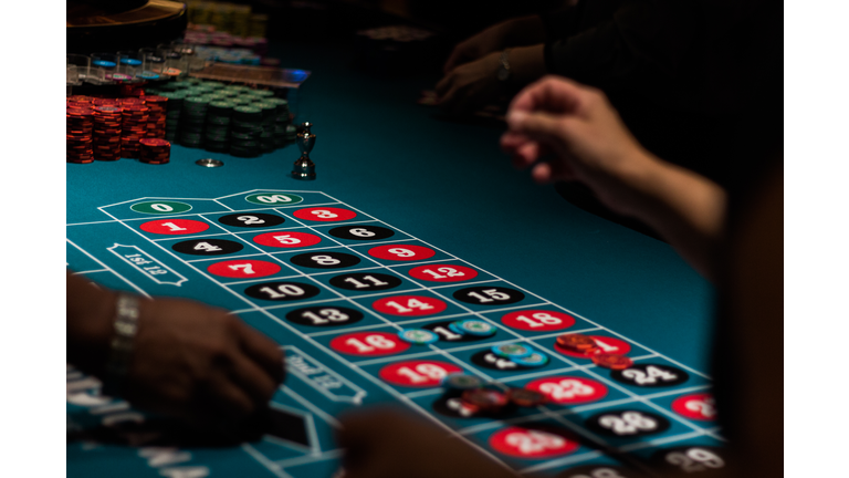 Cropped Image Of People Playing On Gambling Table In Casino