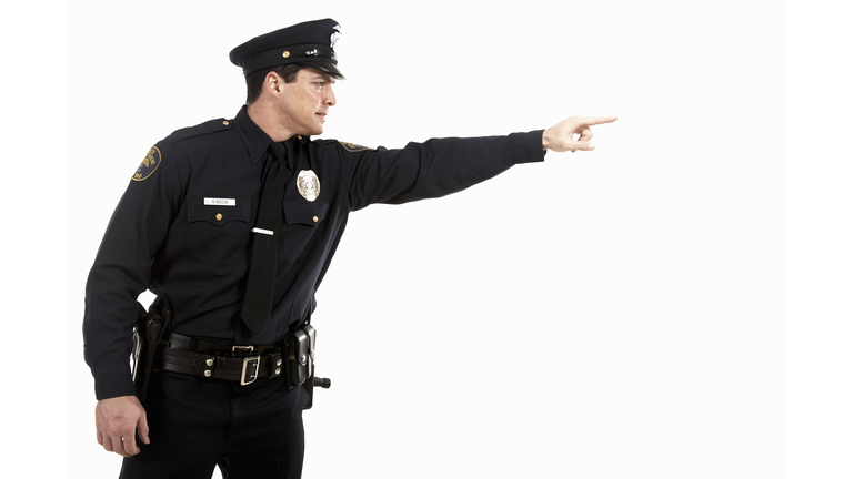 Male police officer pointing