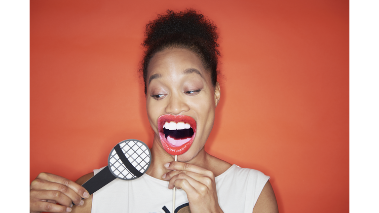 woman singing with microphone