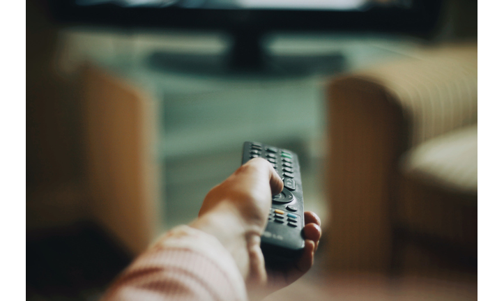 Cropped Hand Of Woman Holding Remote Control