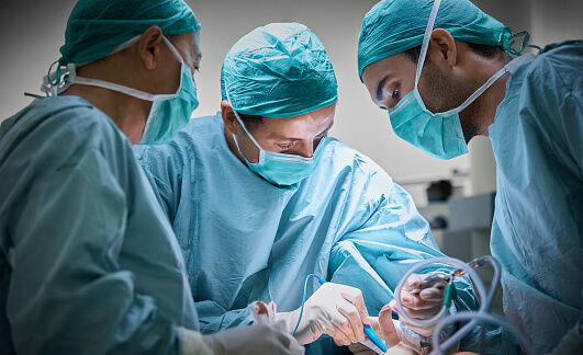 Hospital staff working on a patient