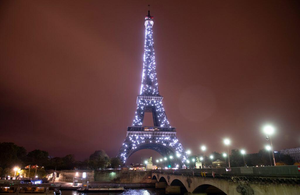Eiffel Tower twinkles in tribute to healthcare workers WATCH iHeart