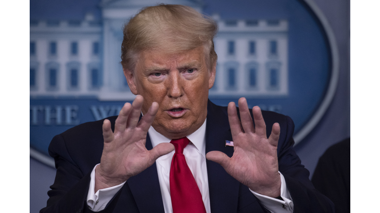 President Donald Trump gestures as he speaks during the daily briefing on the novel coronavirus, COVID-19, at the White House on March 22, 2020, in Washington, DC. (Photo by Eric Baradat/AFP via Getty Images)