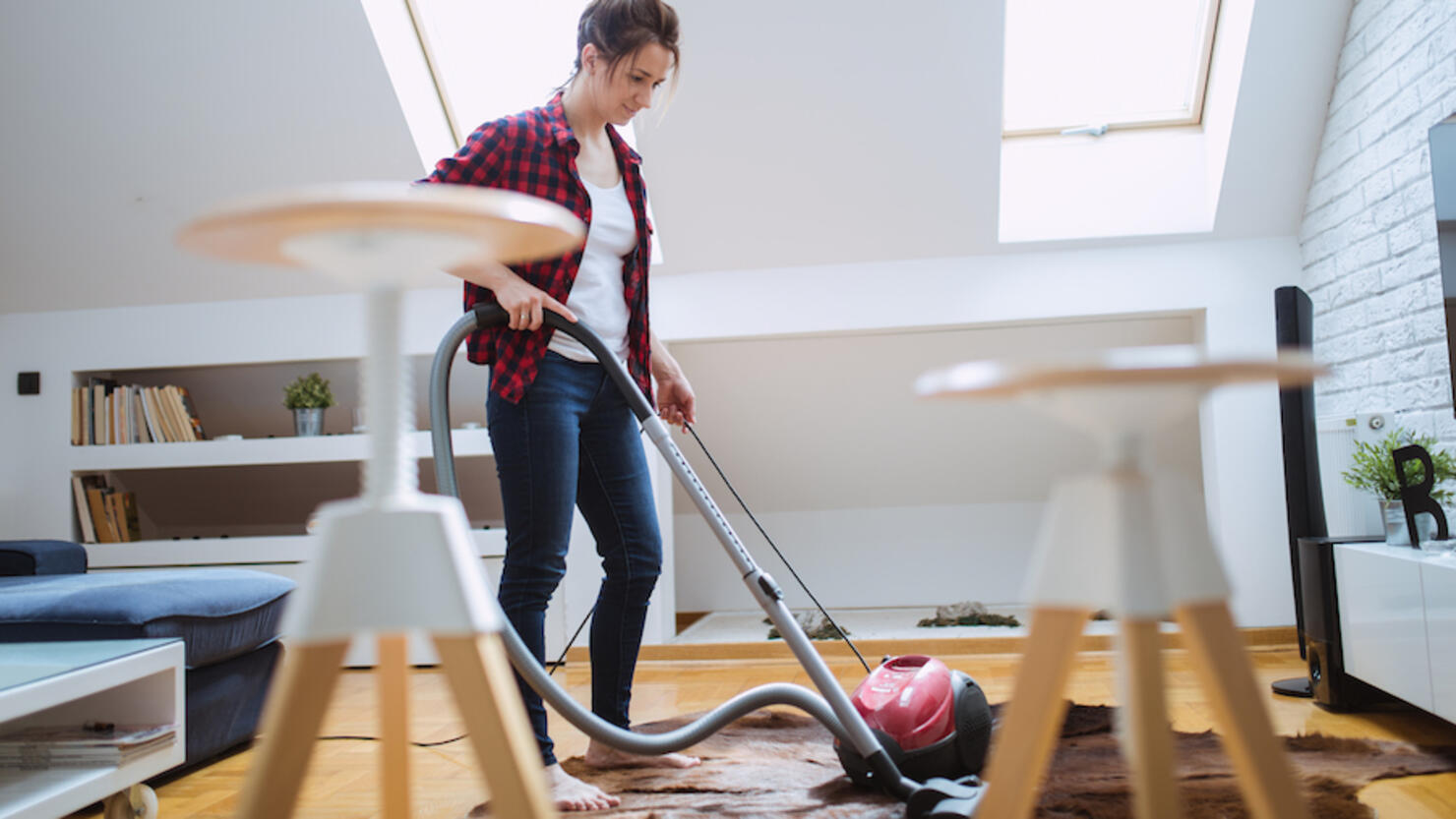 Young woman cleaning home