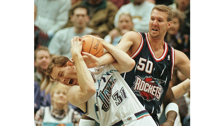 Adam Keefe (L) of the Utah Jazz fights for a rebou