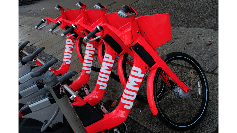 Red electric bicycles from bike-sharing company Jump stand on March 07, 2019 in Berlin, Germany. Jump Bikes so far operates in the United States, Portugal and Germany and is owned by Uber. (Photo by Sean Gallup/Getty Images)