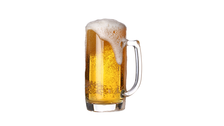 Close-Up Of Beer Glass Against White Background