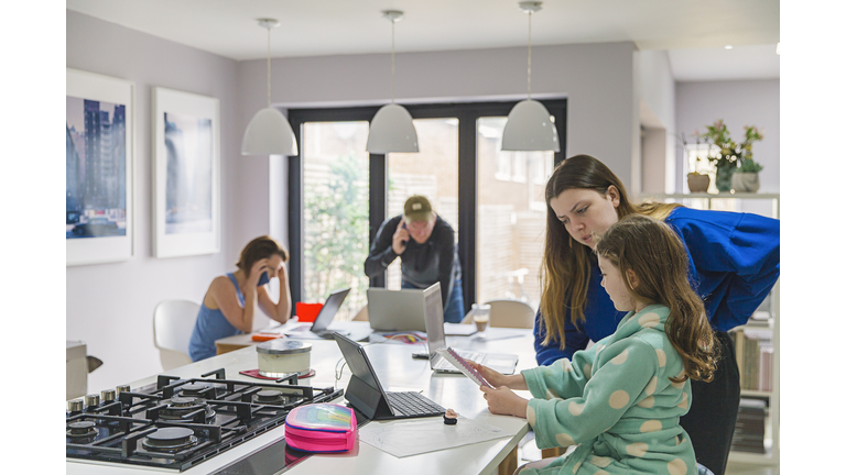 Children studying at home whilst parents work from home