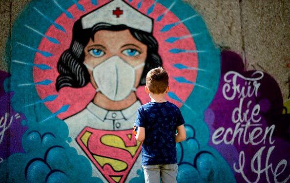 TOPSHOT-GERMANY-HEALTH-VIRUS-STREETART