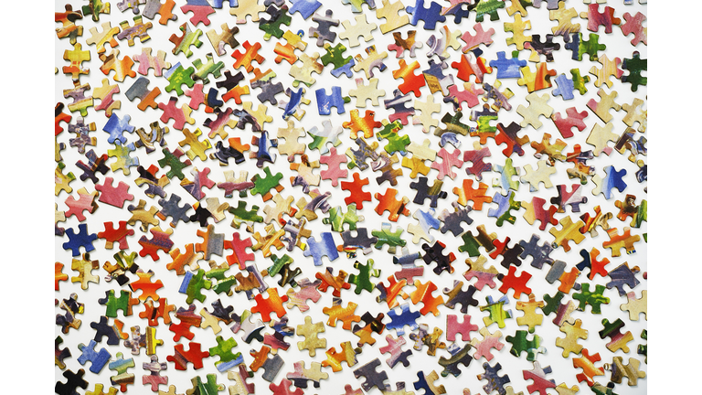 Puzzle pieces on a white surface