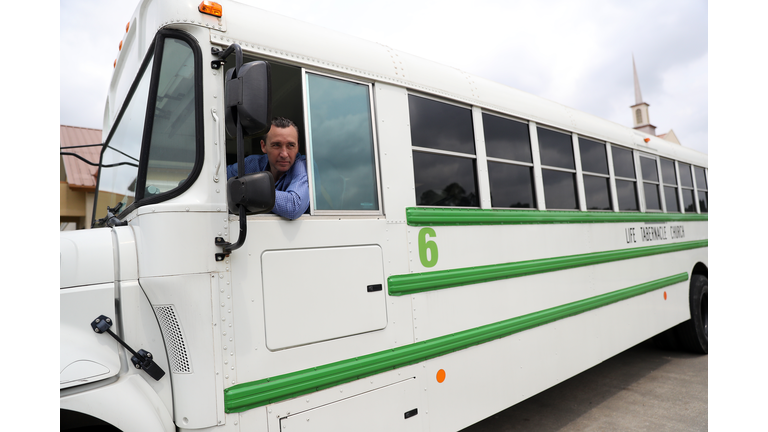  Pastor Tony Spell talks to the media as he drives a bus of congregants from Life Tabernacle Church after Easter church services on April 12, 2020 in Central, Louisiana. (Photo by Chris Graythen/Getty Images)