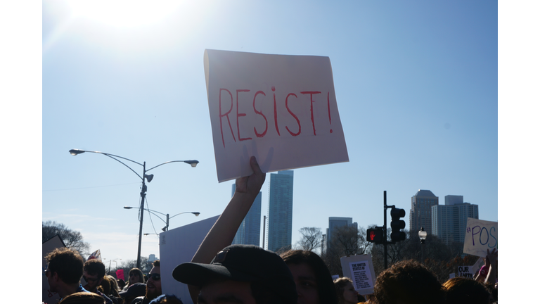 People On Protesting On Street In City