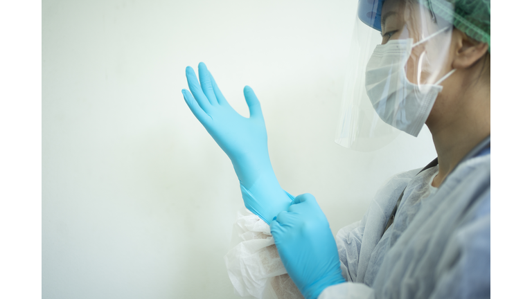 Female doctor teaching How to wearing Surgical mask for protect Covid-19 (coronavirus) and pm 2.5 air pollution