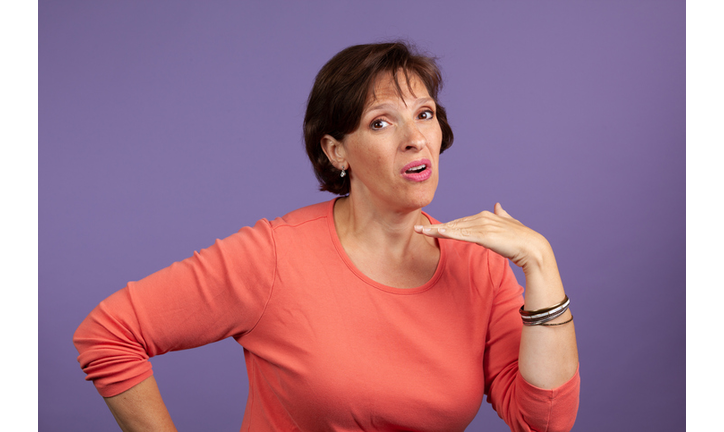 Woman Gesturing While Standing Against Purple Background