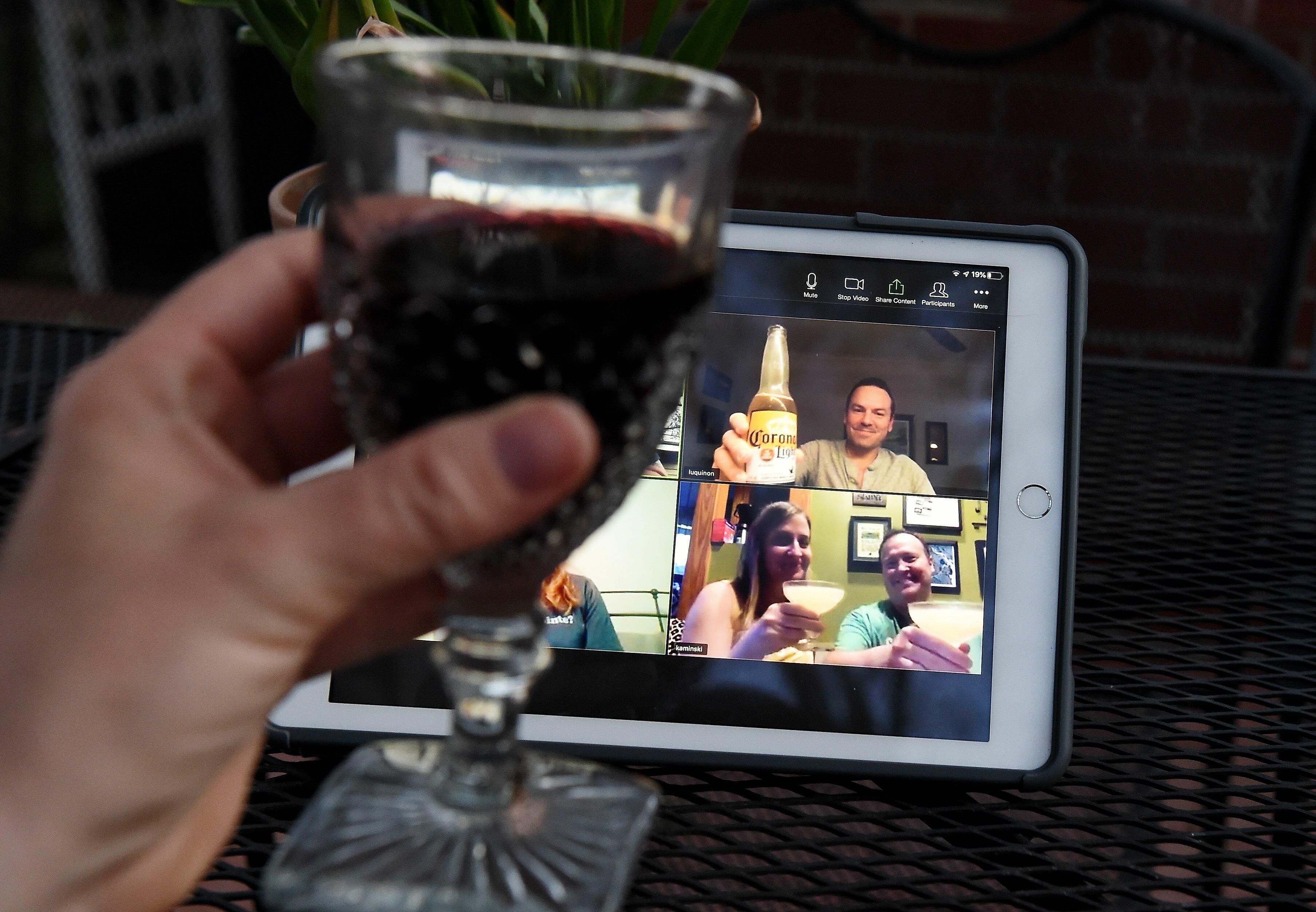 What not to do during a Zoom meeting..drinking and tossing cats