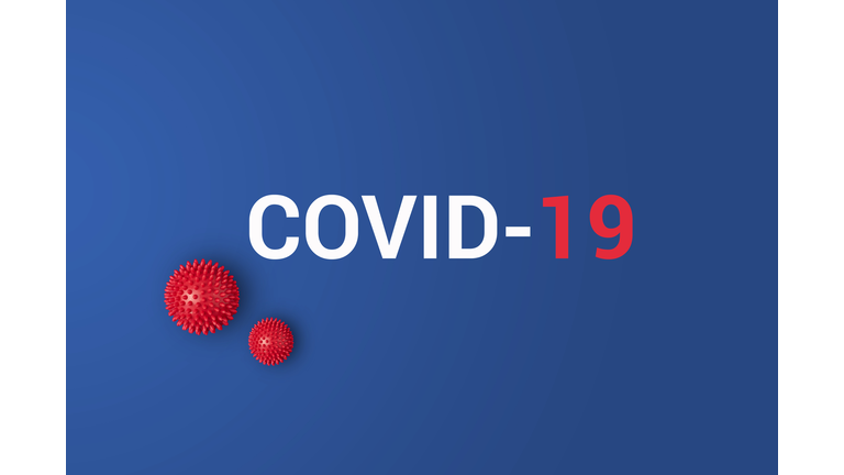 Iinscription COVID-19 on blue background with red ball