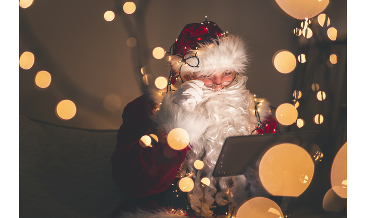 Santa Claus using tablet computer