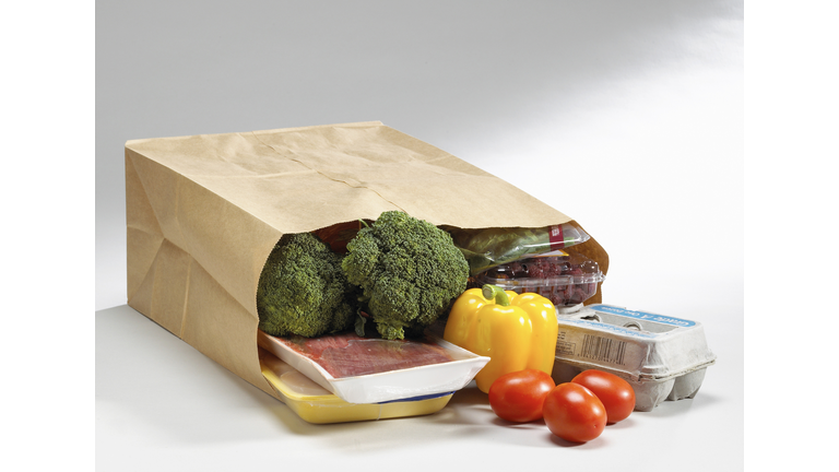 Close up of healthy groceries spilling out of bag