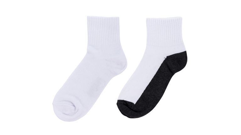 Close-Up High Angle View Of Socks Over White Background