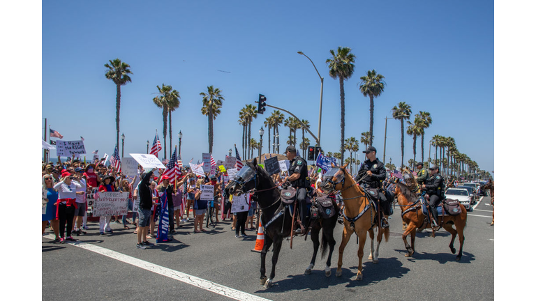 Protest To Reopen California Businesses, Beaches, And Parks Held In Huntington Beach