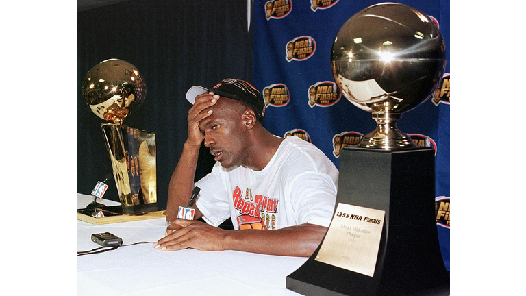 Michael Jordan of the Chicago Bulls talks to the m