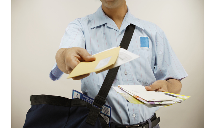 Postman delivering mail