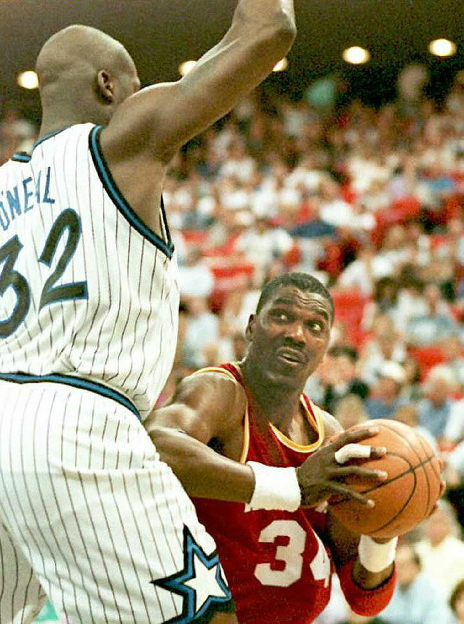 Houston Rockets Hakeem Olajuwon being blocked by S