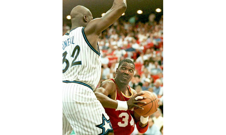 Houston Rockets Hakeem Olajuwon being blocked by S