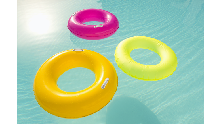 Inflatable Rings Floating In Resort Pool